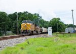 An eastbound grain train flies around the bend at Hallsville